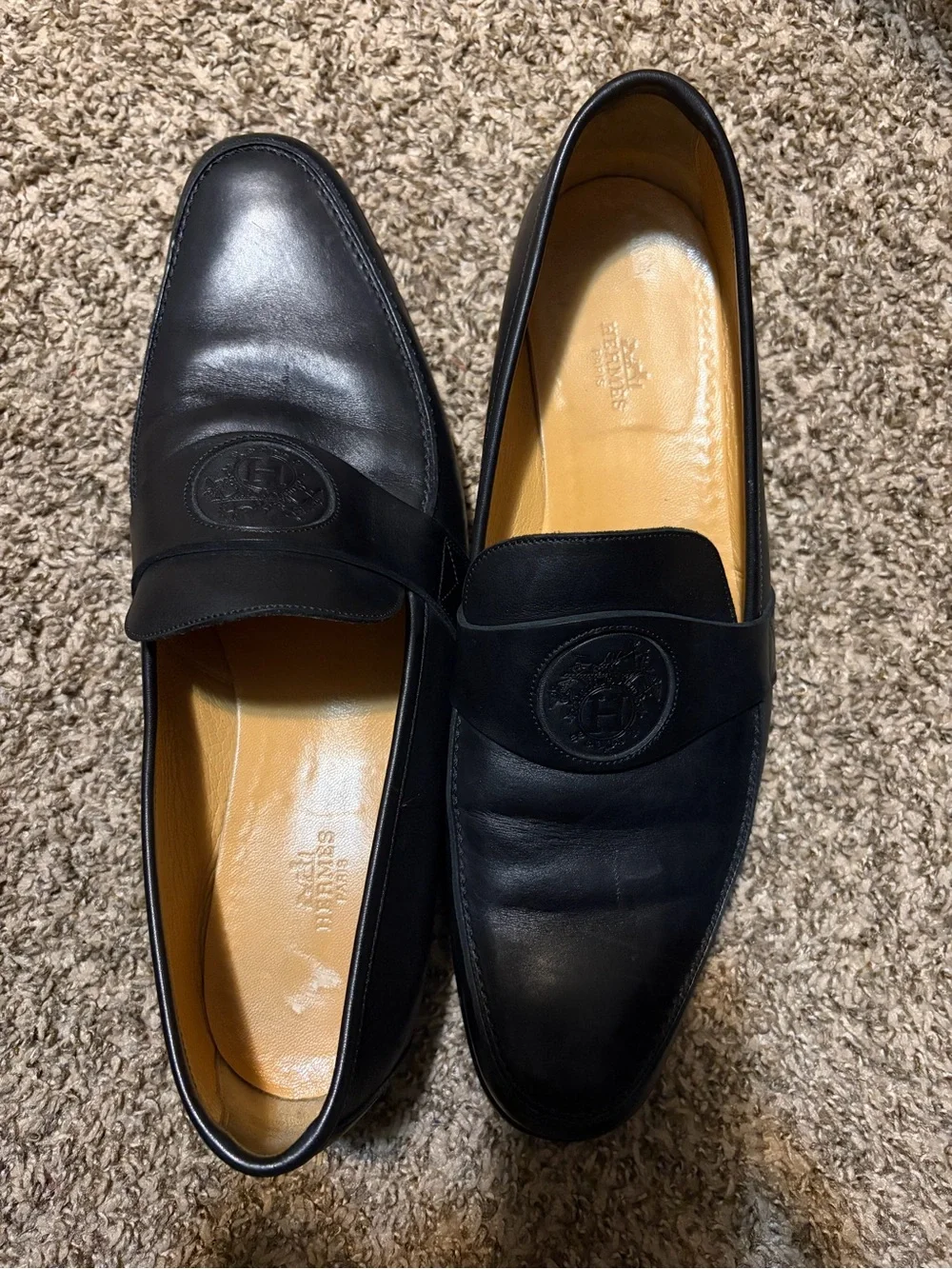 Hermes Black Leather Penny Loafers with Embossed Medallion